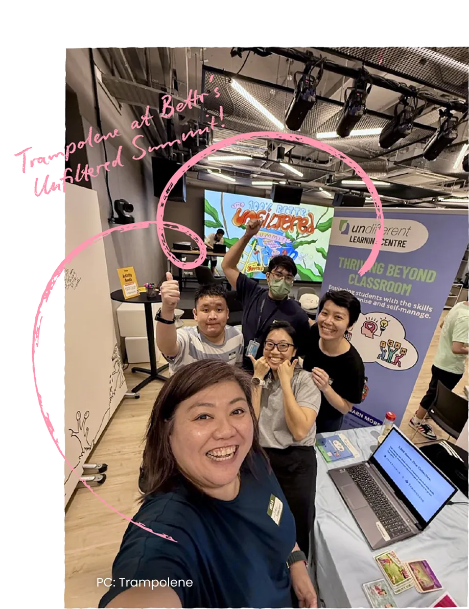 A selfie taken at an exhibition booth with young people gathered behind. Handwritten caption: Trampolene at Bettr’s Elevate Summit.