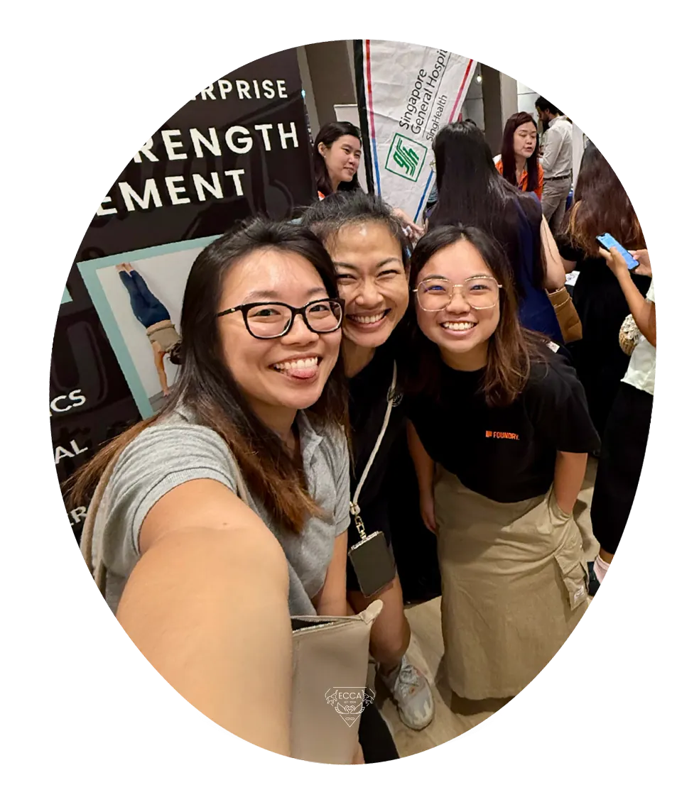 Three women taking a selfie together at a conference.
